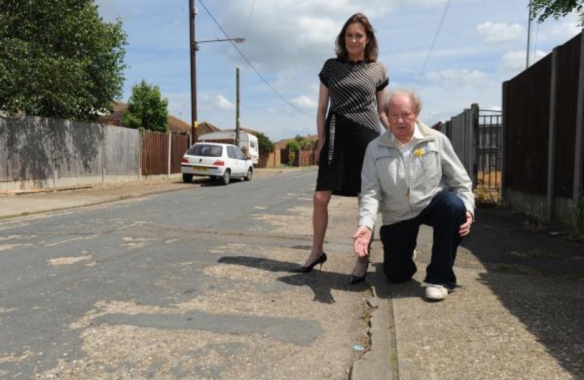 Rebecca inspecting a pothole