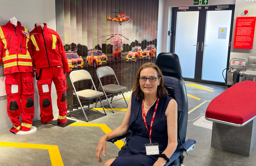 Rebecca in a mock Air Ambulance cockpit seat