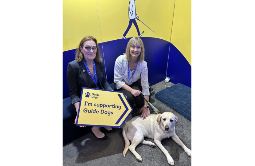 Rebecca Harris MP visiting Guide Dog UK's stand at Conservative Party Conference 2026