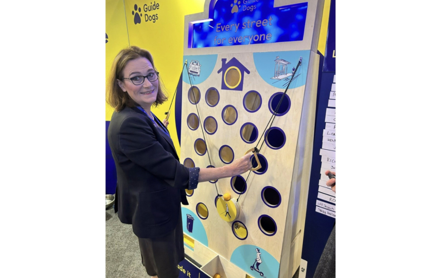 Rebecca Harris MP visiting Guide Dog UK's stand at Conservative Party Conference 2026