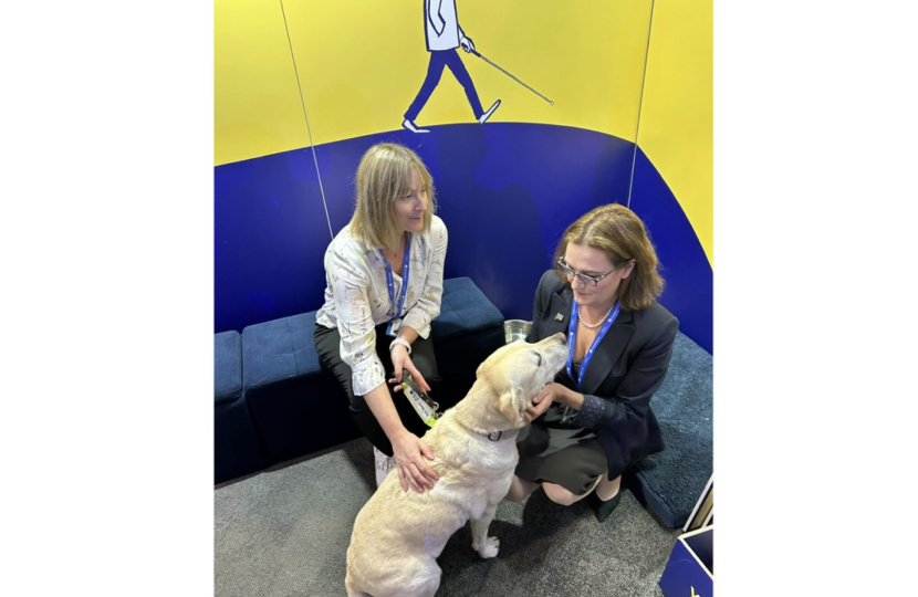 Rebecca Harris MP visiting Guide Dog UK's stand at Conservative Party Conference 2026