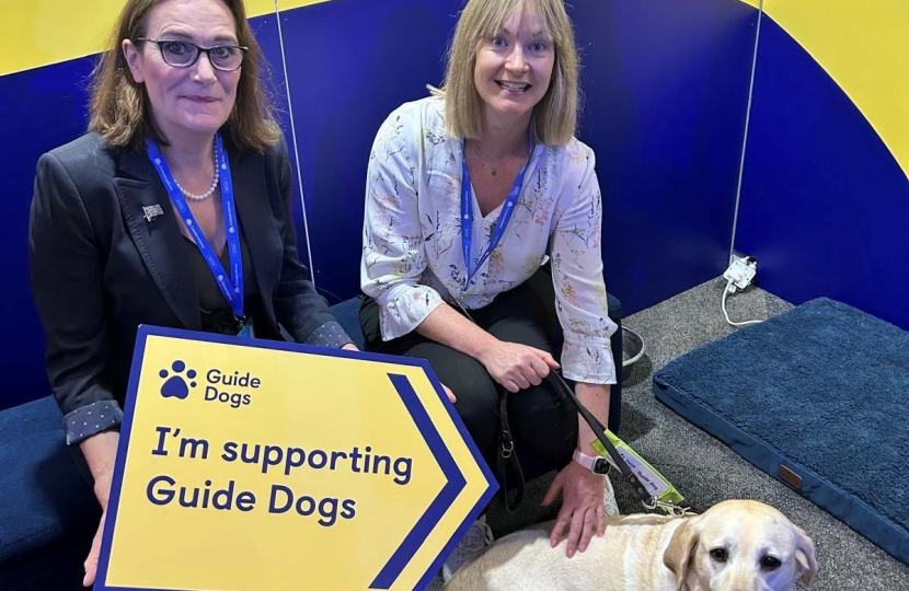 Rebecca Harris MP visiting Guide Dog UK's stand at Conservative Party Conference 2026