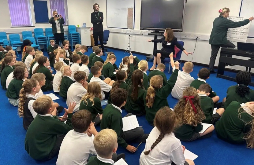 Rebecca speaking with students