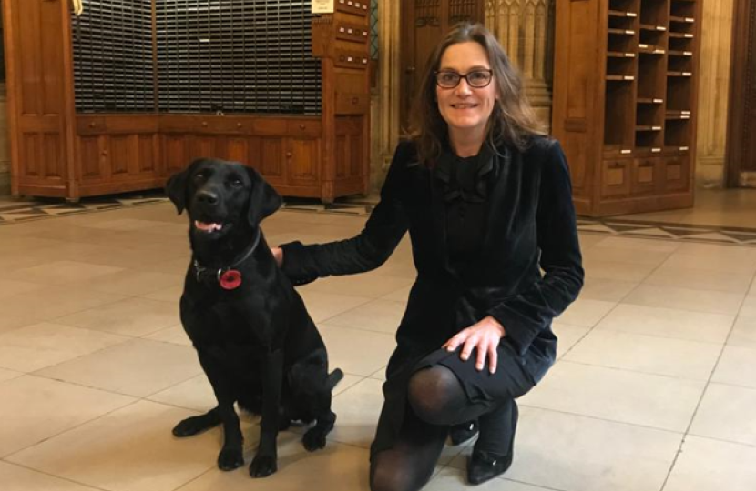Rebecca and a black lab in Parliament