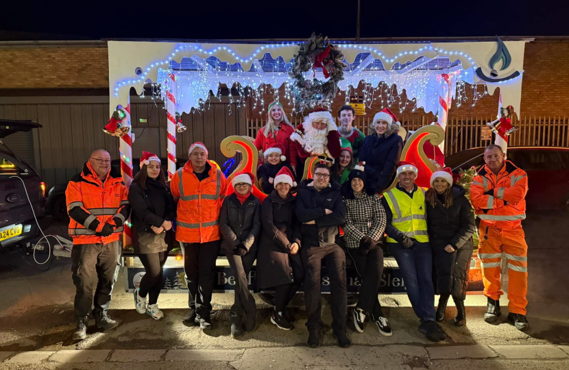 Santa and the volunteers with the sleigh