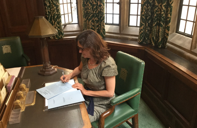 Rebecca signing documents