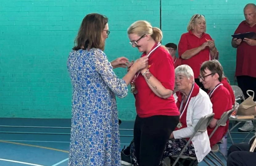 Rebecca handing out medals