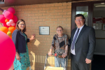 Dame Rebecca in front of plaque at Appleton House