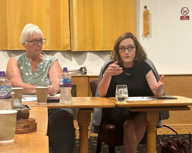 Rebecca speaking at the meeting