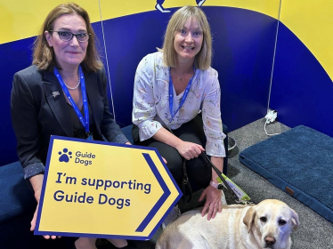 Rebecca Harris MP visiting Guide Dog UK's stand at Conservative Party Conference 2026