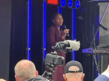 Kemi Badenoch speaking at the event