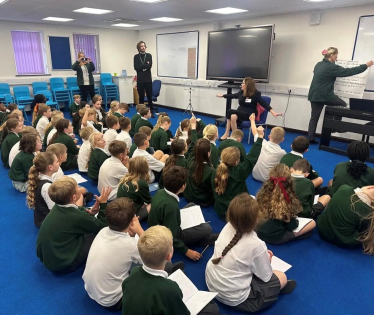 Rebecca speaking with students