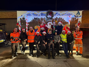 Santa and the volunteers with the sleigh